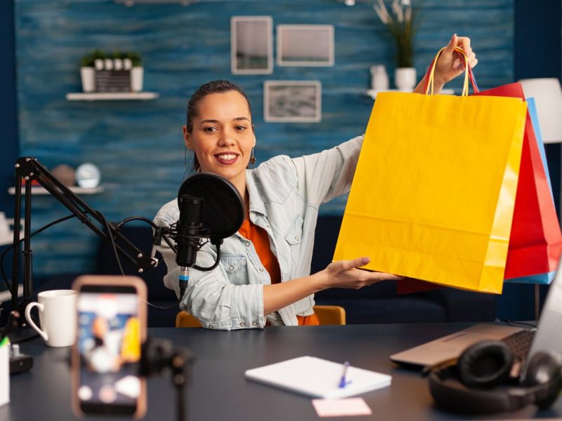 social-media-star-doing-present-giweaway-loyal-subscribers-creative-content-creator-making-video-blog-concept-speaking-looking-professional-camera-home-studio-podcast_482257-16612