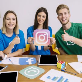woman-holding-instagram-like-icon-with-his-friends-showing-thumbup-sign